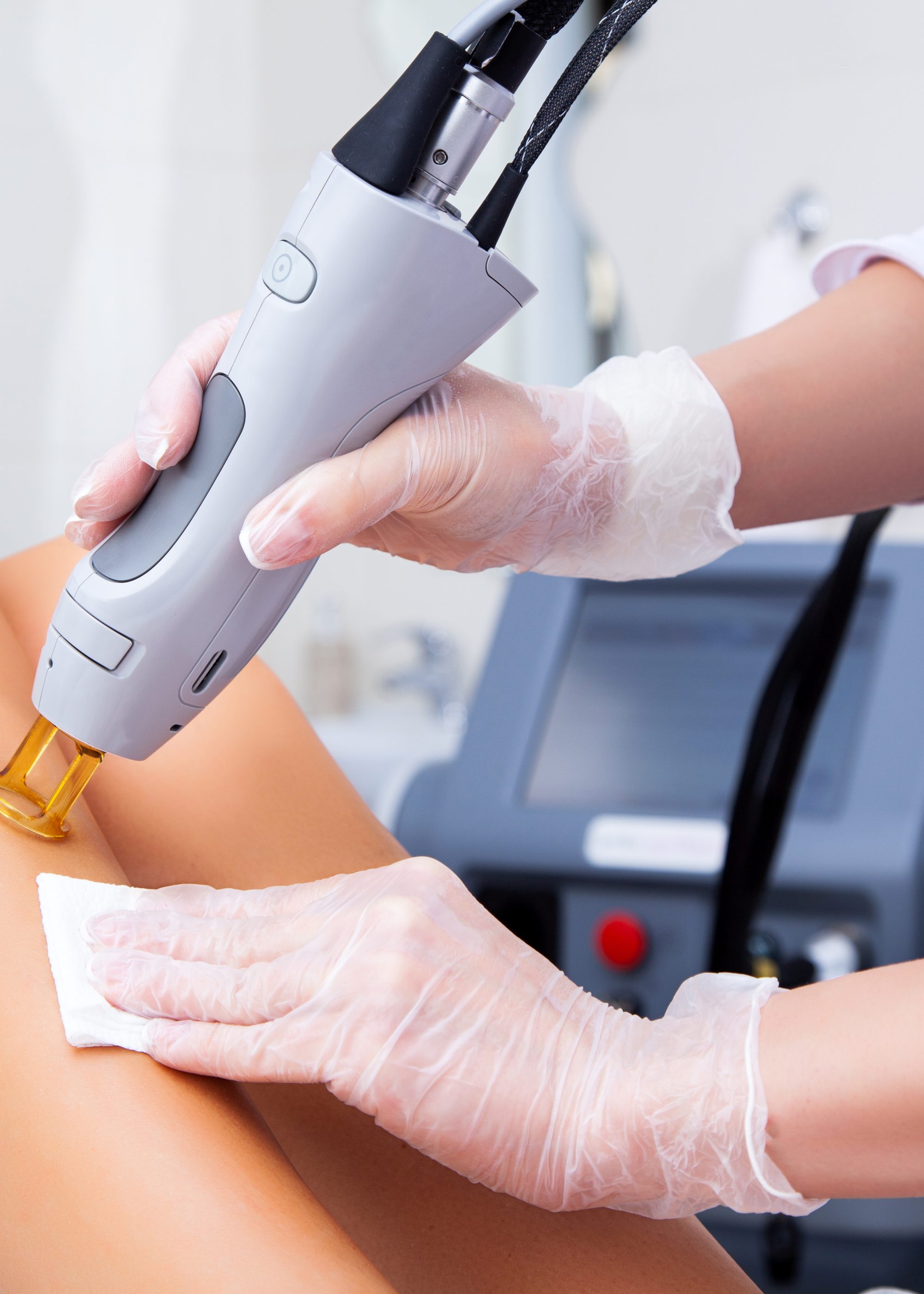 Close-up of a female cosmetologist in a medical coat making a yo Close-up of a female cosmetologist in a medical coat